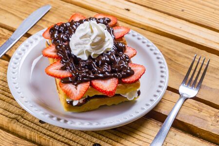 Strawberry dessert with chocolate and whipped creamの写真素材