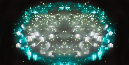 Oval made of bokeh, on black backgroundの写真素材