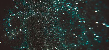 Abstract bokeh on black background like starsの写真素材