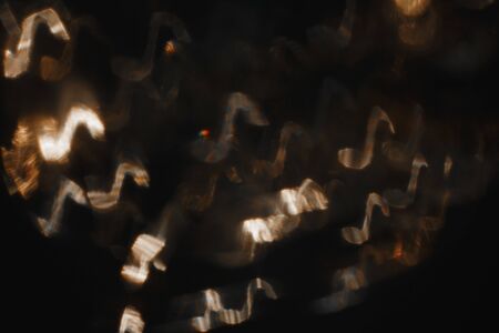 Gold notes on black backgroundの写真素材