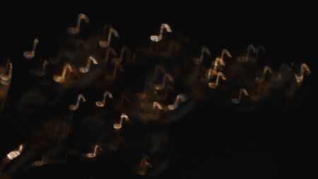 Gold notes on black backgroundの写真素材