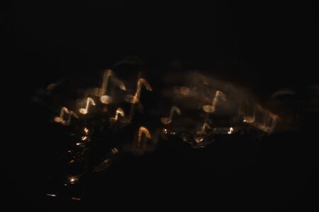 Gold notes on black background