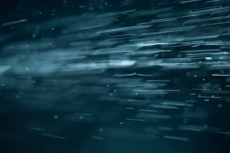 abstract White flakes on blue night backgroundの写真素材