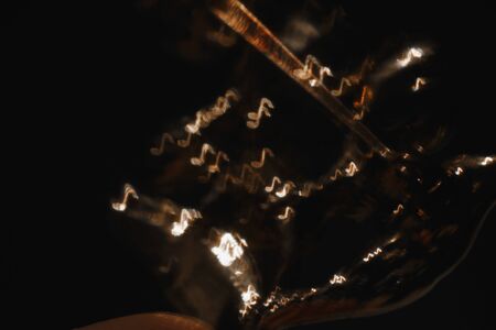 Gold notes on black backgroundの写真素材