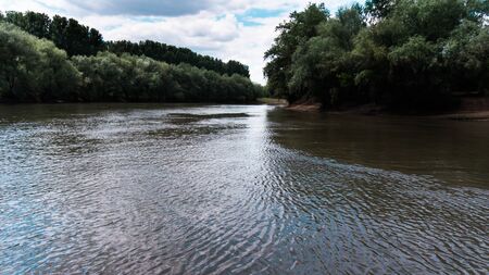 The flowing water of the Dniester River in summer