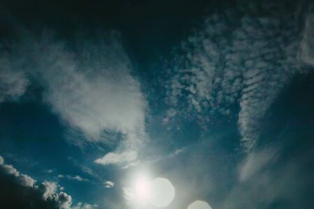 The moon and the stars in the night and cloudy sky. High quality photoの写真素材
