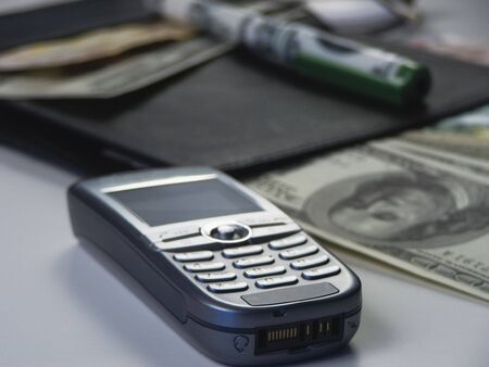 Business objects - focus on bottom of mobile phoneの写真素材