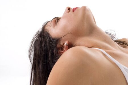 Young brunette girl is making sensual poseの写真素材