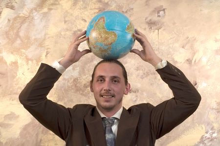 Businessman holding globeの写真素材