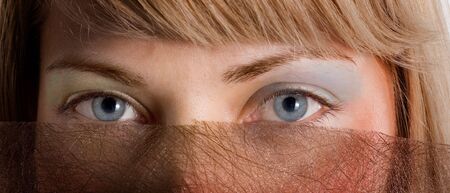 Close up of woman with blue eyeの写真素材