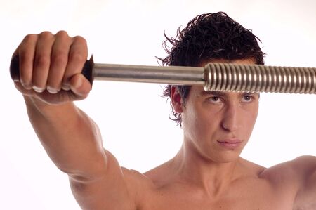 Builderman training his body with power twister isolated on whiteの写真素材