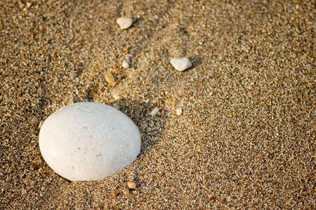 Backgrounds of sand beach and little stoneの写真素材