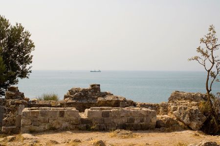 Ship on the high sea, view from top of ruin castle from middle ageの写真素材