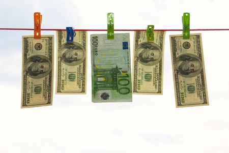 Money, dollars and euro hung on clotheslineの写真素材
