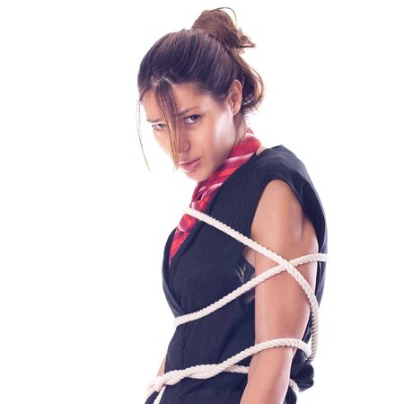 Young beautiful girl tied with a ropeの写真素材