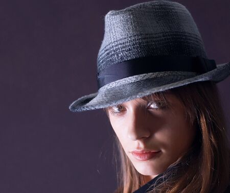 Portrait of a young sensual fashion woman with hat  の写真素材