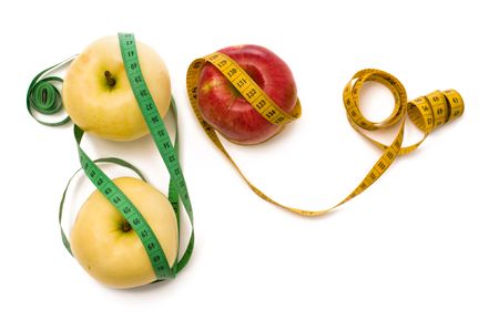 Tape measure wrapped around appliesの写真素材