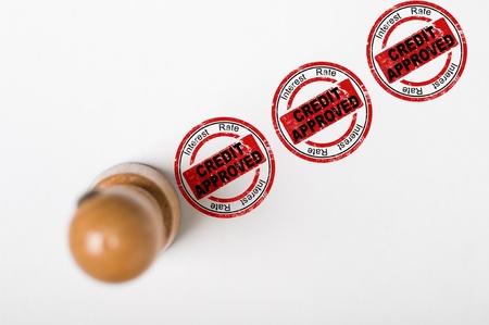 Round stamp with impress text on paper about credit and interest rate, grungy lookの写真素材