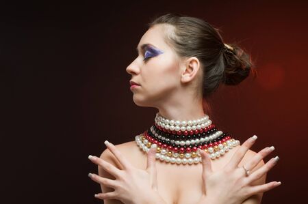 Young beautiful woman wearing pearls around her neckの写真素材