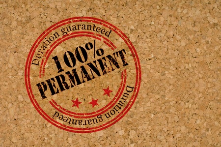 Stamp with "Permanent" text on texture of woodの写真素材