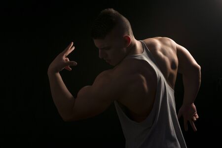 Muscular builder man training his bodyの写真素材