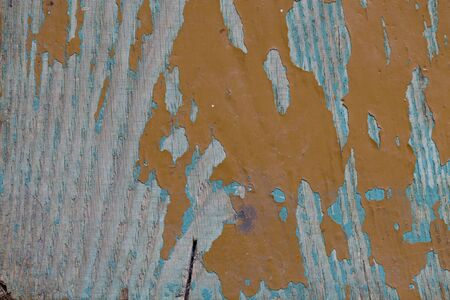 old painted Board with collapsed and cracked paint close-upの写真素材