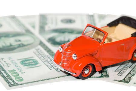 classic small decorative of model red toy car is on the banknote.の写真素材