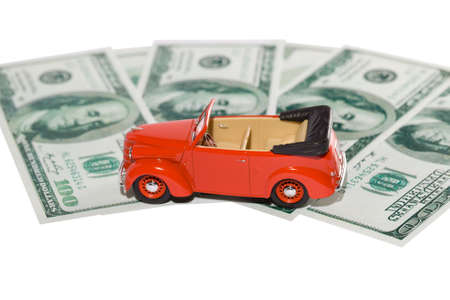 classic small decorative of model red toy car is on the banknote.の写真素材