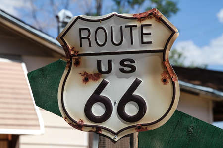 Metal plate along Route 66 .Route 66 (officially US Route 66) is an old American route that linked...