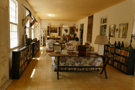 Interior of Ernest Hemingway's house in Havana Cuba. Lounge with chairs and library. Hemingway is an american writerのeditorial素材