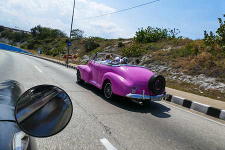 Cuba old pink car on the road. Photo taken from a carのeditorial素材
