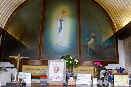 Banneux, Belgium, Interior of the Chapel of the Apparitons with the portrait of Mariette Beco. Banneux is a place of pilgrimage in Belgium where the Virgin Mary appeared there to Mariette Beco in 1933.のeditorial素材