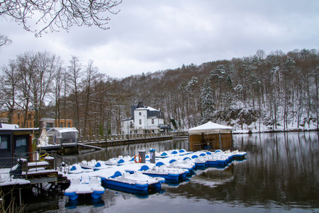 Belgium, Spa, View of Lake Warfaaz under the snow with its pedal boats. Lake Warfaaz is located at the gates of the town of Spa; in the Ardennes, in the east of the province of LiÃ¨ge.のeditorial素材