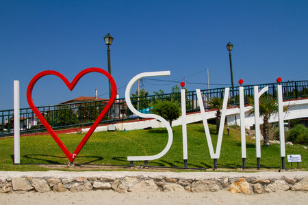 Siviri, Greece, July 10, 2021. Greece, I love Siviri. Former fishing port of Kassandria, today a beautiful small tourist village with an incredible sandy beachのeditorial素材