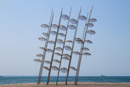 Thessaloniki, Greece, July 15, 2021. The Umbrellas sculpture by George Zongolopoulos, located on the promenade facing the seaThe Umbrellas sculpture by George Zongolopoulos, located on the promenade facing the seaのeditorial素材