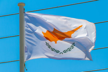 Kalamata, Greece, July 21, 2022. Flag of Cyprus. This flag depicts the map of the island placed above two olive branches on a white background.のeditorial素材