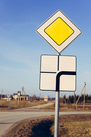 Priority sign with extra board of priority directionsの写真素材