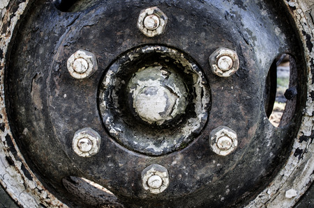 Old rusty wheel and wheel bolts of Russian truck 'Gaz'の写真素材
