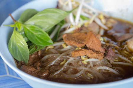 Small rice noodle in thick soup with beef in Thailandの写真素材