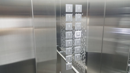 A shiny new elevator and buttonの写真素材