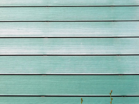 textured wooden wall of turquoise mint boards with a wood patternの写真素材