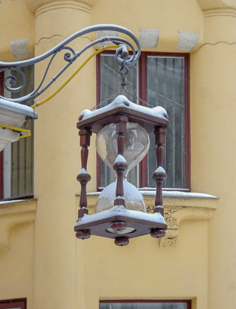 Hourglass shaped street lamp in old city, selective focus. High quality photo