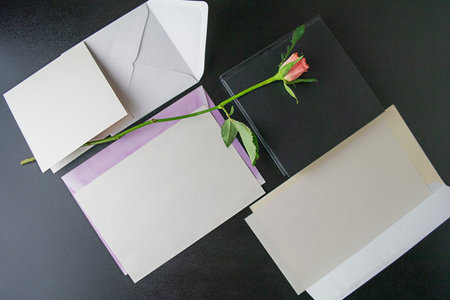 Cards and envelopes and rose for mockup, top view, flatley. High quality photo