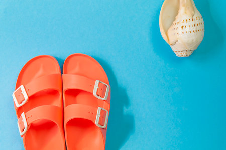 Beach accessories on blue background top view, copy space.の写真素材