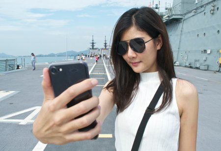 Woman selfie on the big shipの写真素材
