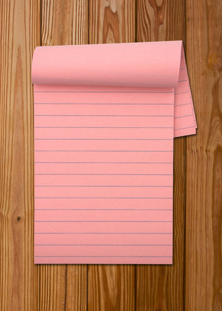 Notepad on woodの写真素材