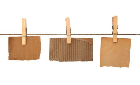 close up of a notes and a clothes pegs on white background の写真素材