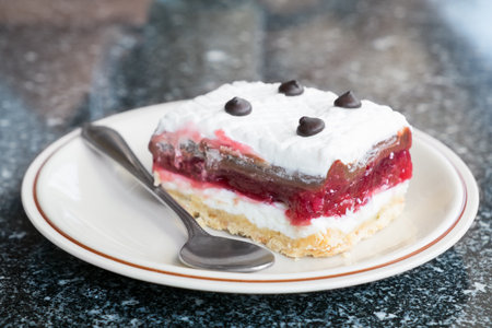 Close-up of delicious raspberry cake isolated on white