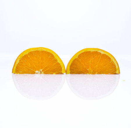 Two oranges in white background.の写真素材