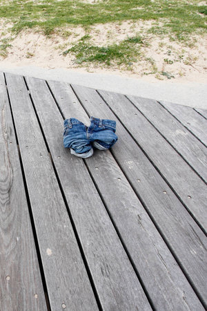 Child spread jeans forget to leave the seaside.の写真素材